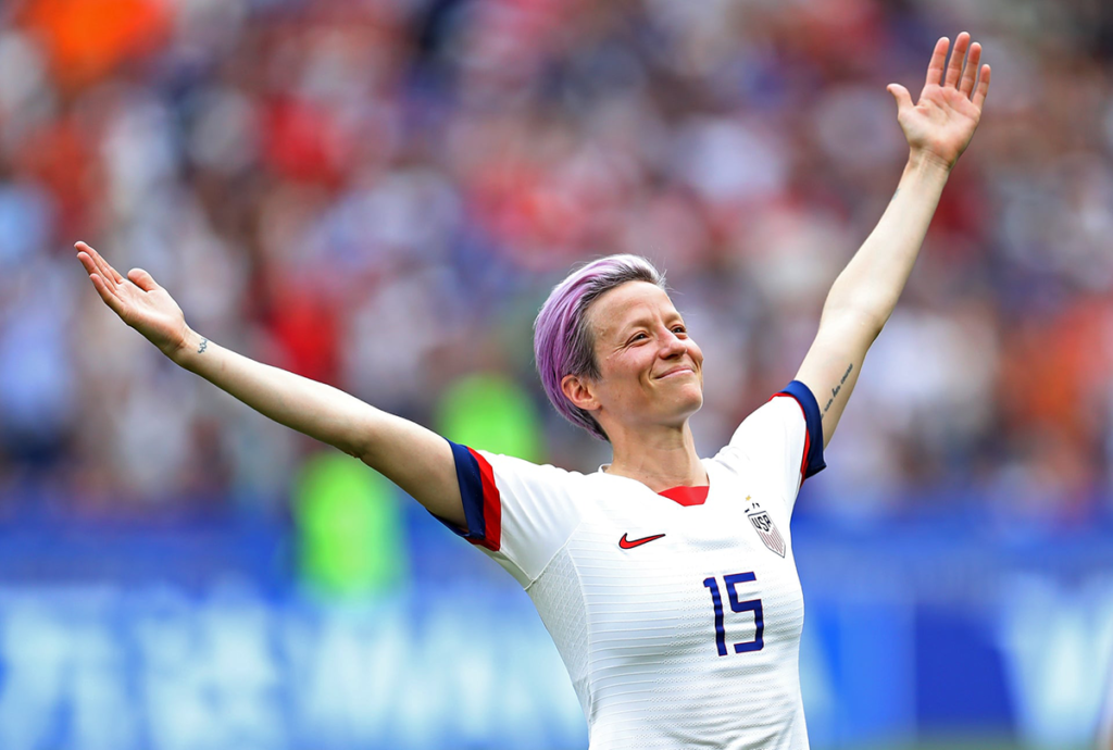 Megan Rapinoe, captain and star of the U.S. Women’s National Team, celebrates with her arms up in the air after scoring the opening goal in the World Cup final.